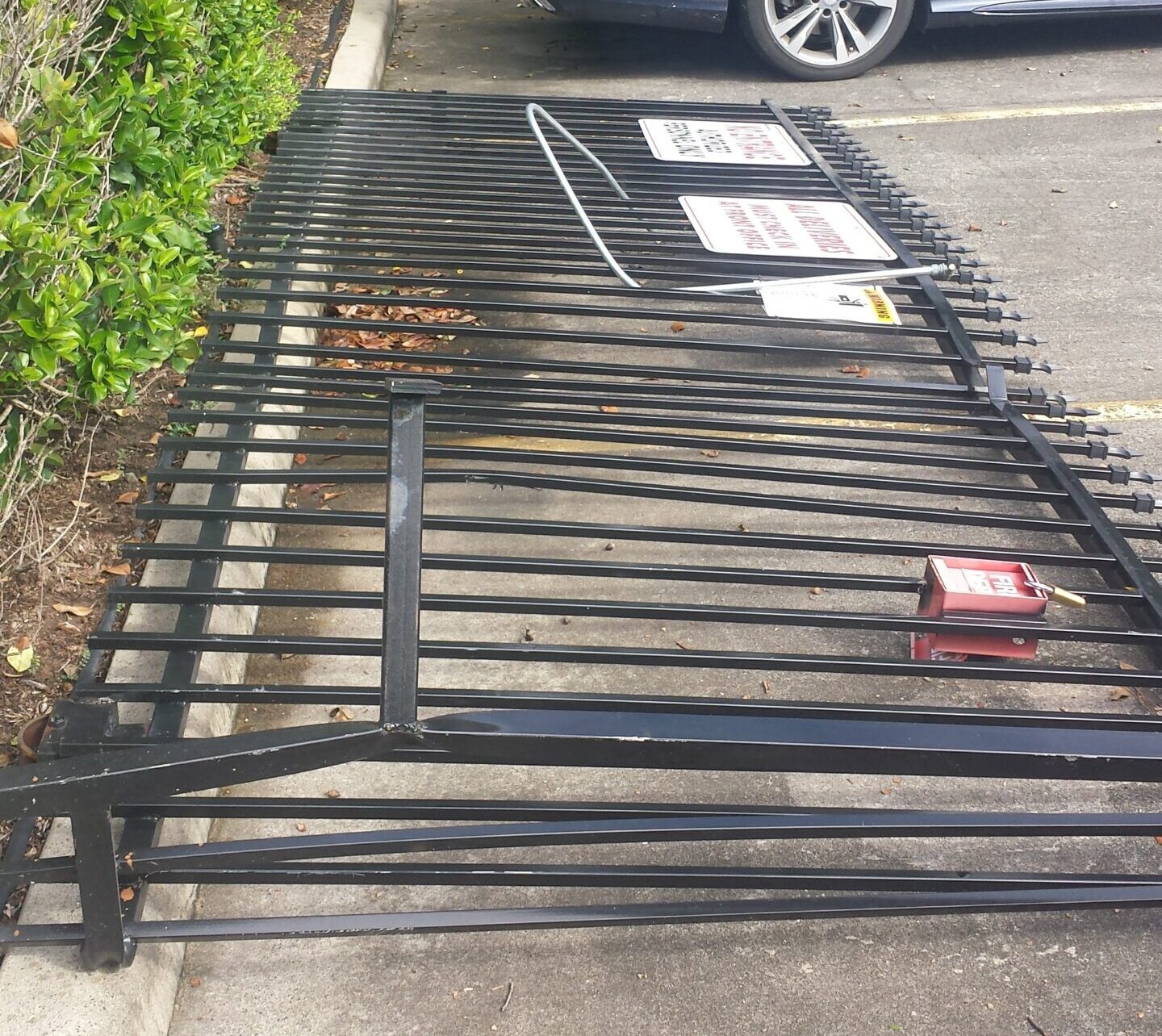 Damaged apartment gate before repair at a Houston TX multifamily property