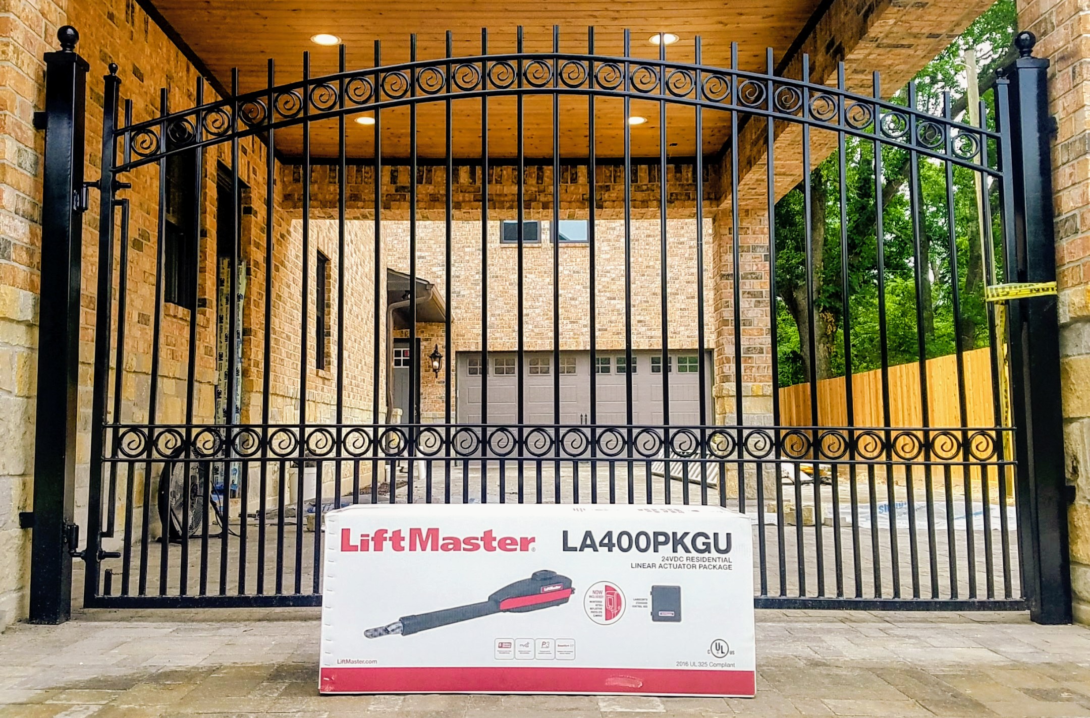 Ornamental iron swing gate with LiftMaster LA400 gate opener installed in Houston