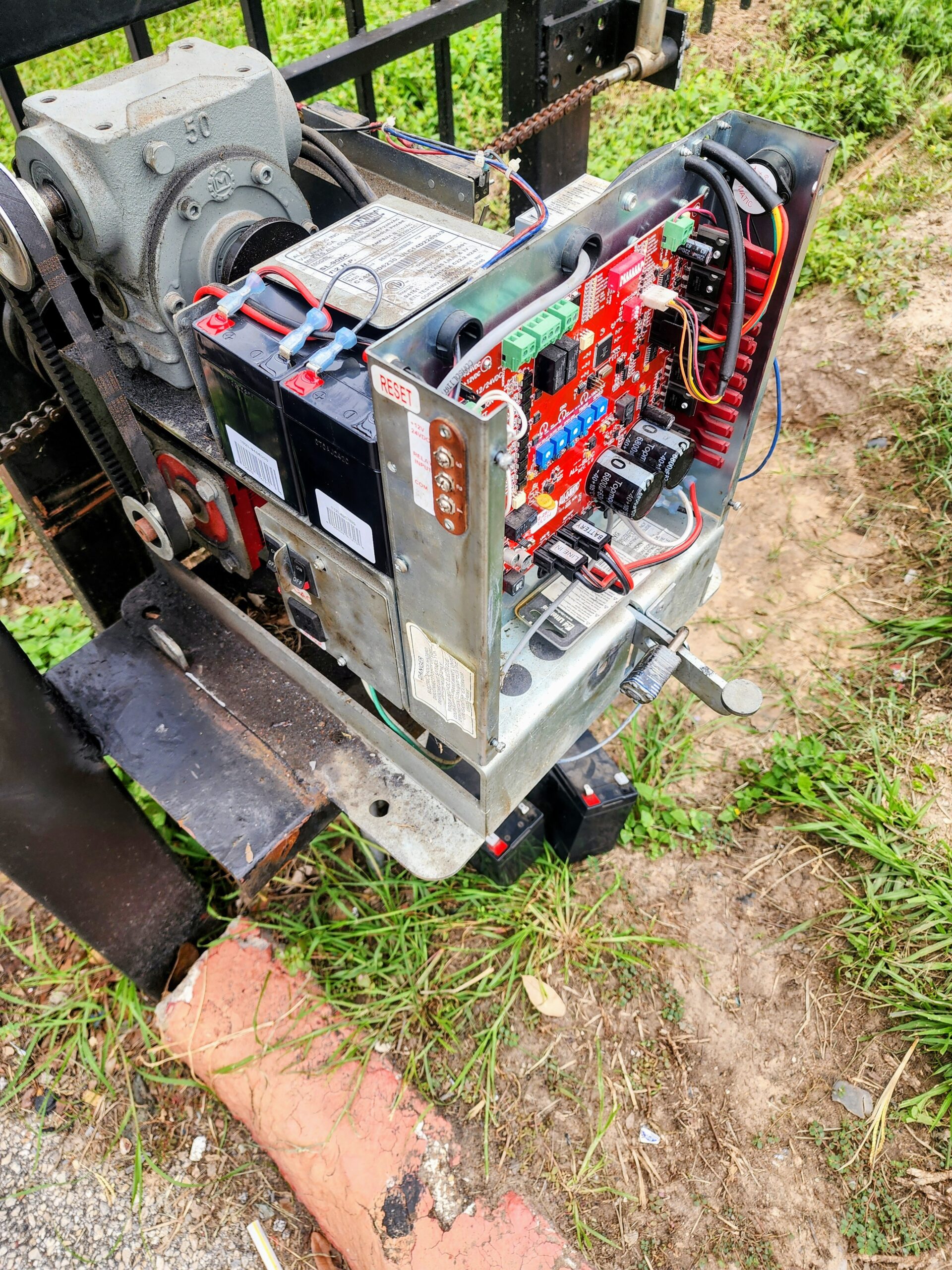 All-O-Matic slide gate opener repair with exposed control board and motor in Houston TX