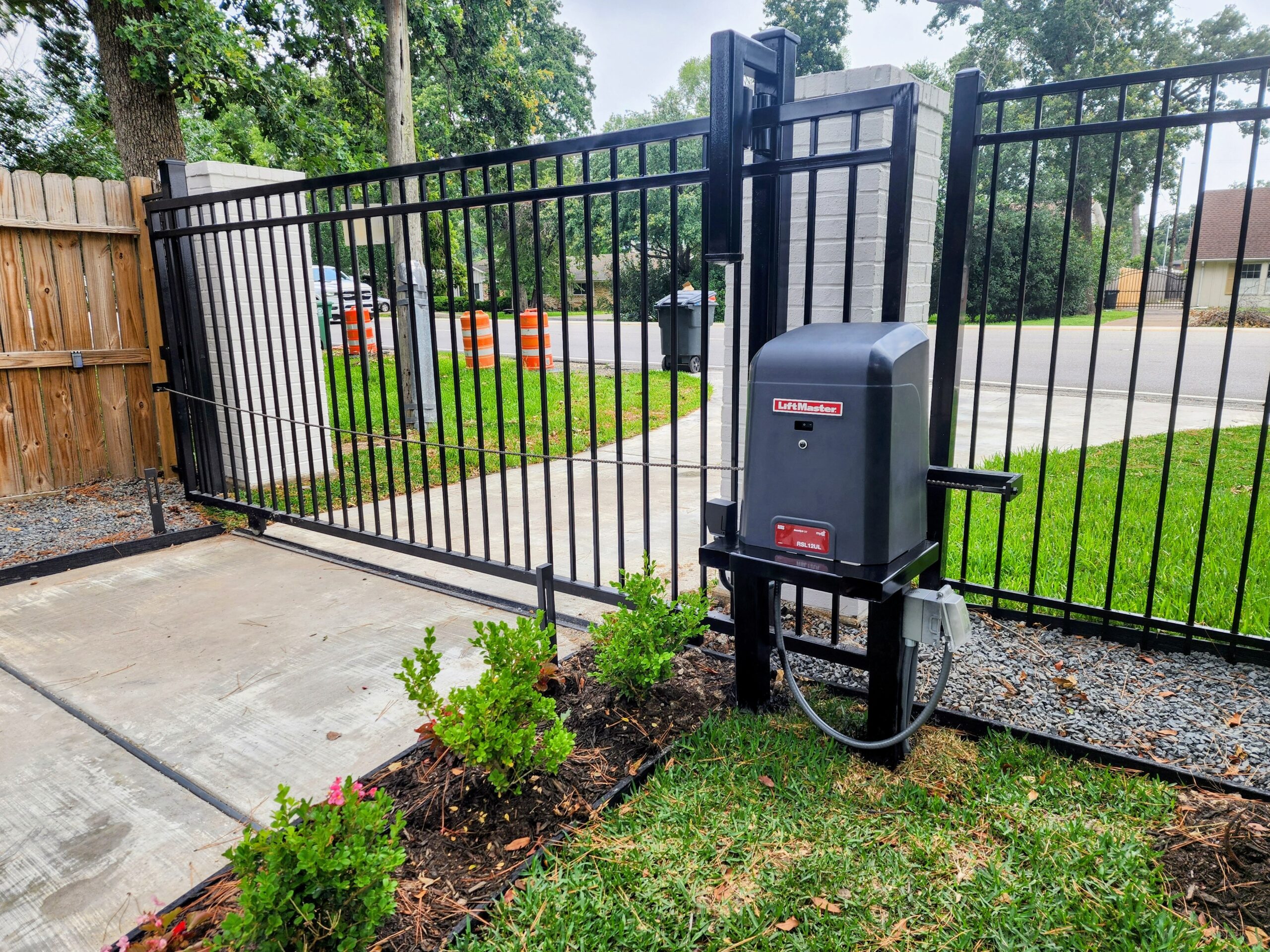 Residential LiftMaster RSL12 slide gate opener installation in Houston