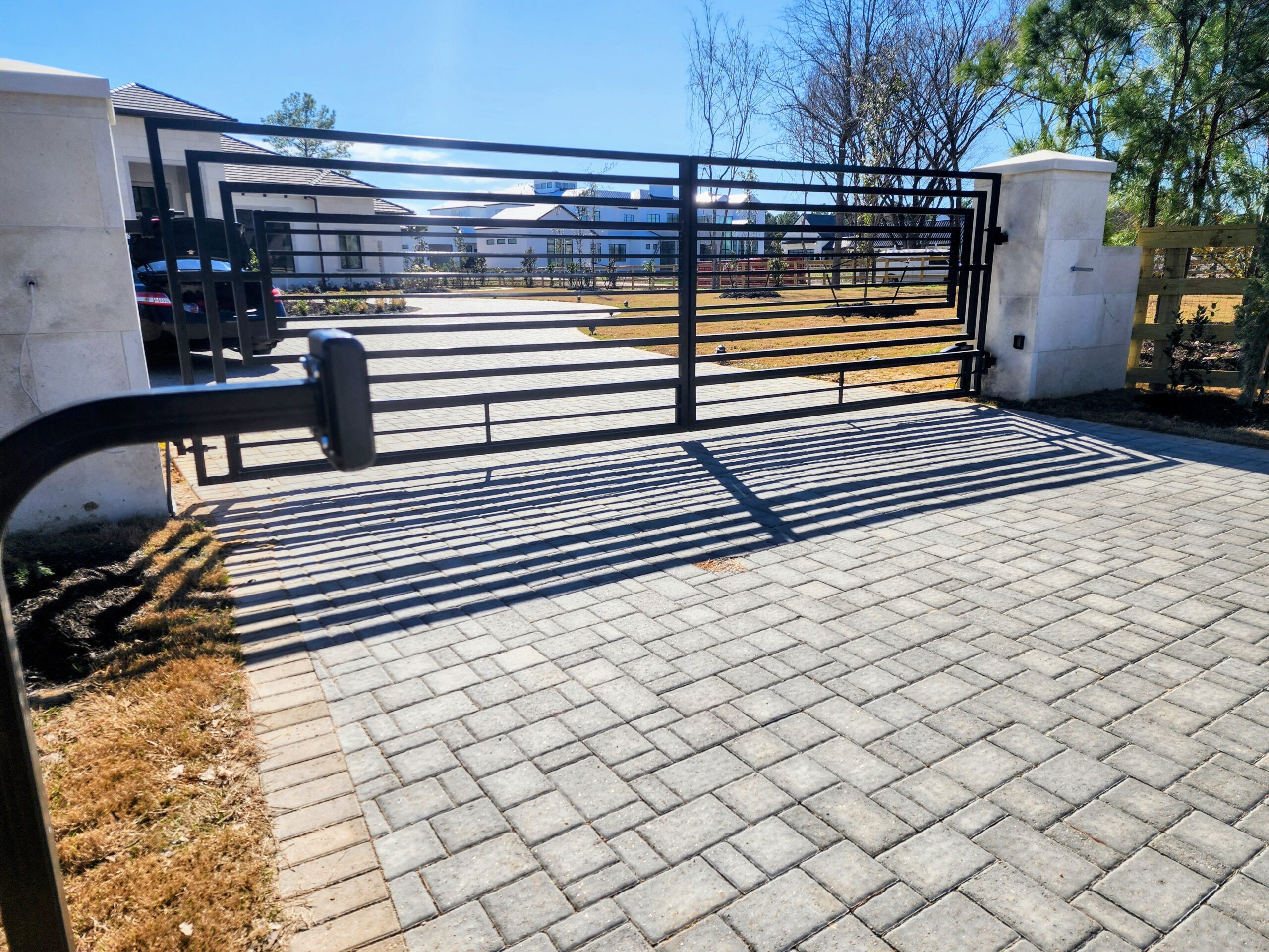 Electric gate repair in Houston showing a completed automatic gate system