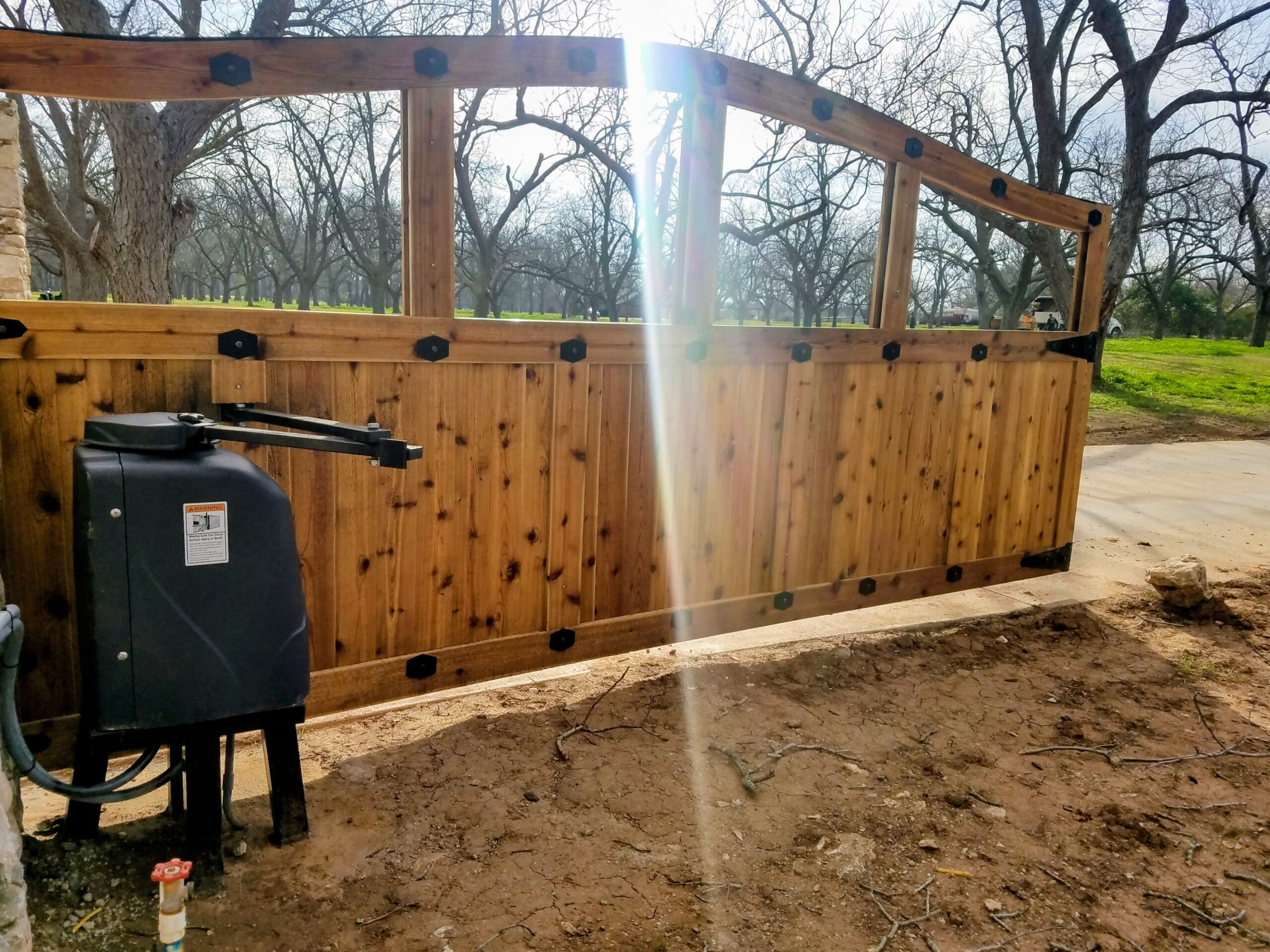 Residential heavy duty pad mounted Viking swing gate opener installation in Houston