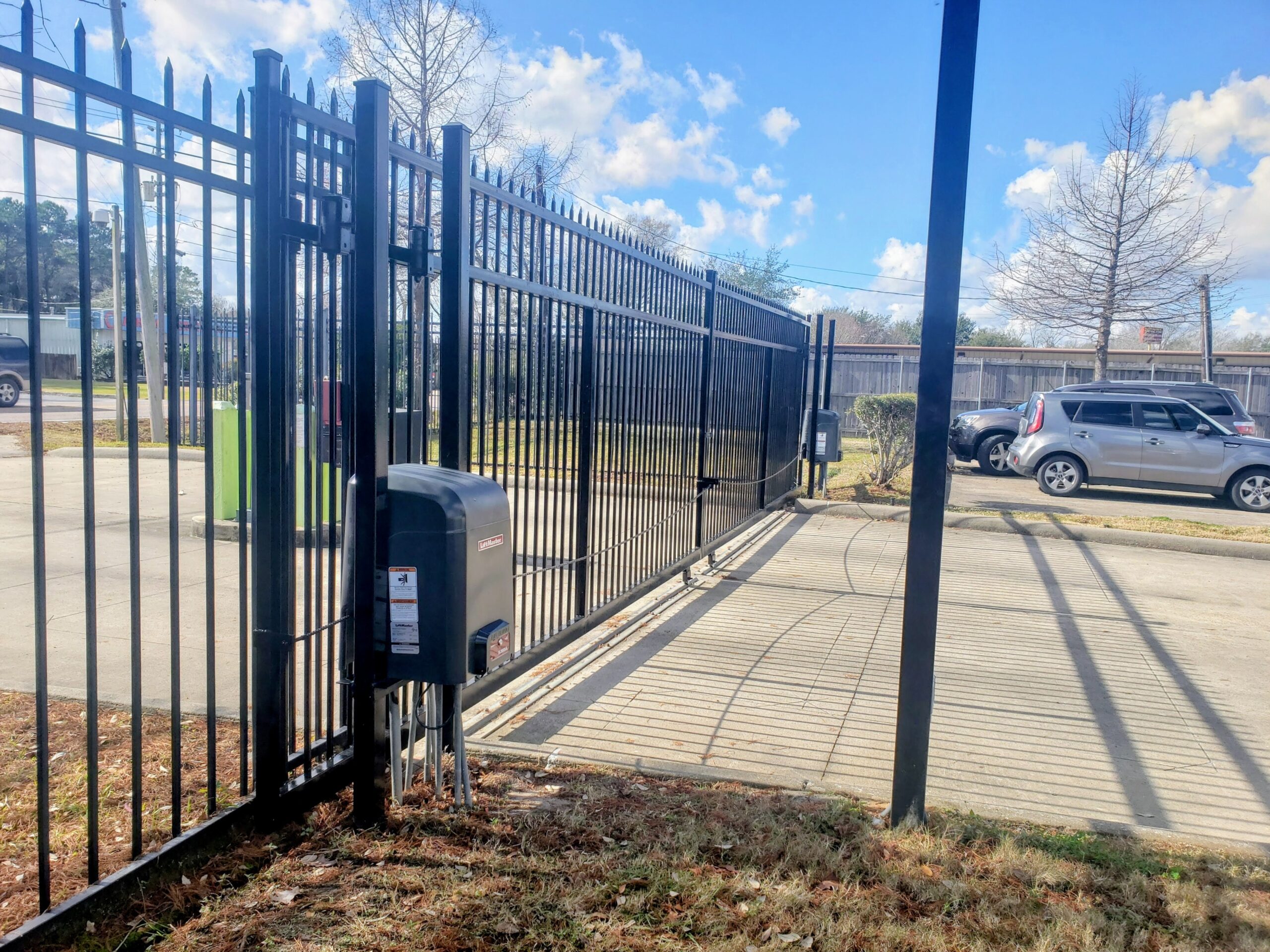 Dual LiftMaster SL3000 commercial slide gate opener installation in Houston