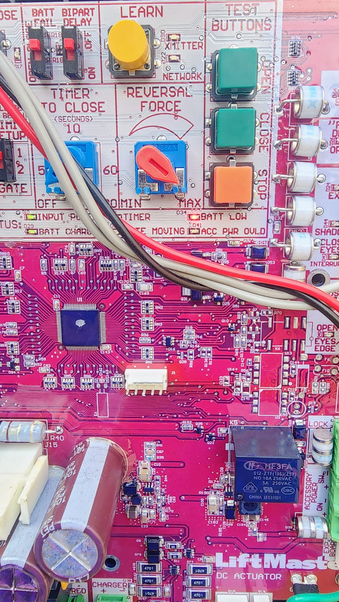 LiftMaster gate opener control board showing battery low warning light during repair in Houston TX